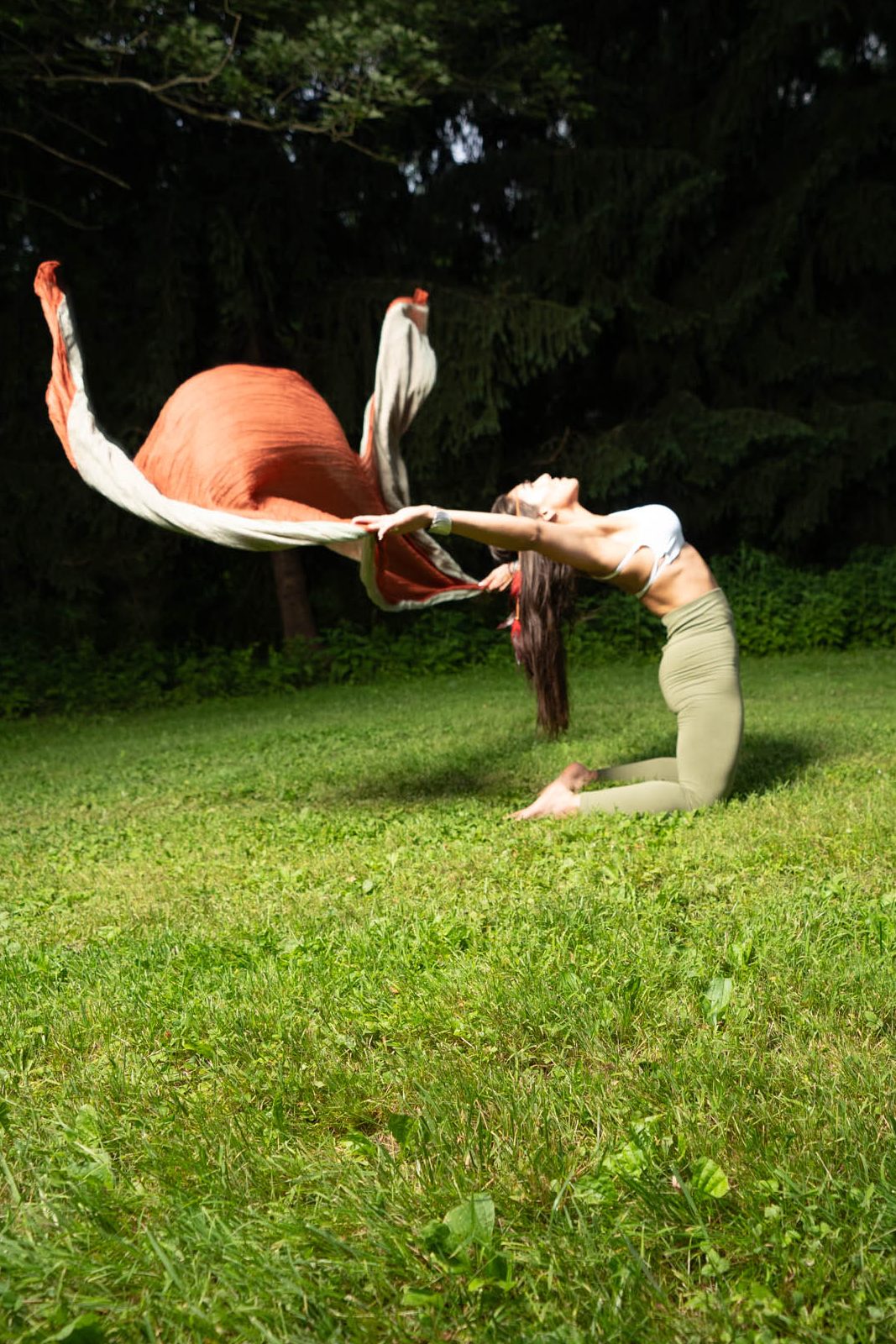 Gera, founder of CoraZONE Fitness, dancing freely in nature — embodying feminine empowerment through movement.
